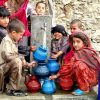 Afghan children gathering water