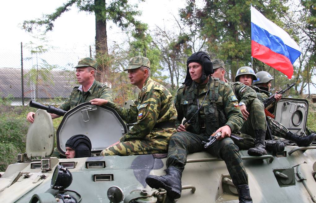Russian soldiers tank flag Tass